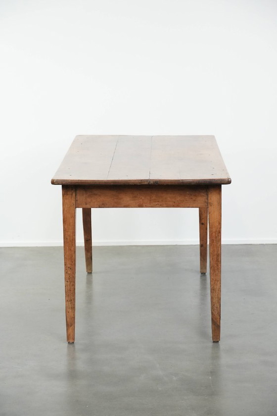 Image 1 of Early 19th century French fruitwood dining table with two drawers