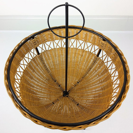 Image 1 of Vintage rattan basket on 4 black lacquered metal legs, 1950