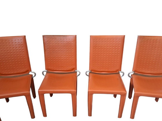 Image 1 of Set van 4 designstoelen in oranje leer en vintage ijzer.