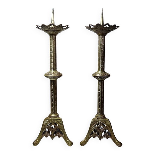 Large pair of antique gilded bronze candlesticks, Gothic style from the 19th century.