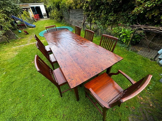 Image 1 of Grande table de salle à manger coloniale en teck massif avec 8 chaises et coussins