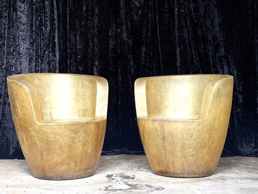 Set of sculptural chairs in fiberglass with gold patina