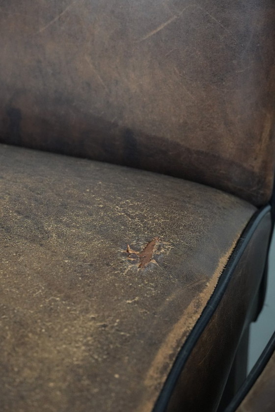 Image 1 of 8 x Tijdloze vintage schapenleren eetkamerstoel met karakter