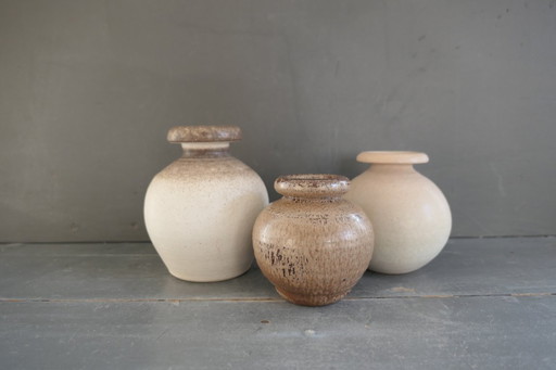 Vintage set of round vases in cream and brown tones