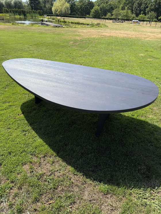 Image 1 of Teardrop-shaped table
