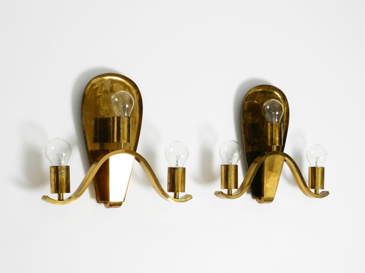 Pair of large heavy Mid Century brass wall lights from a German church