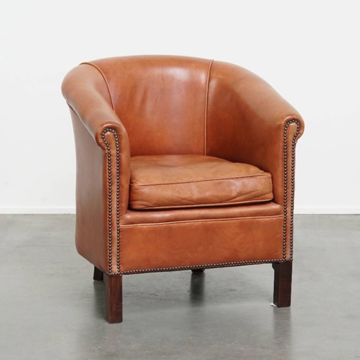 Beef leather English style club chair in a light cognac color