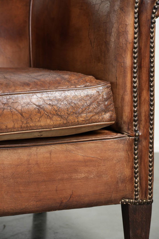 Image 1 of 2 fauteuils club vintage en peau de mouton, au look superbe et à l'assise confortable.