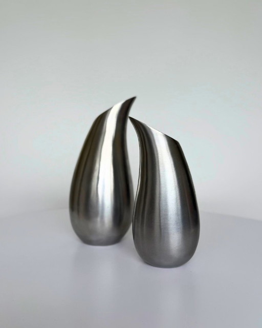 Vintage teardrop shaped vases made of brushed aluminium