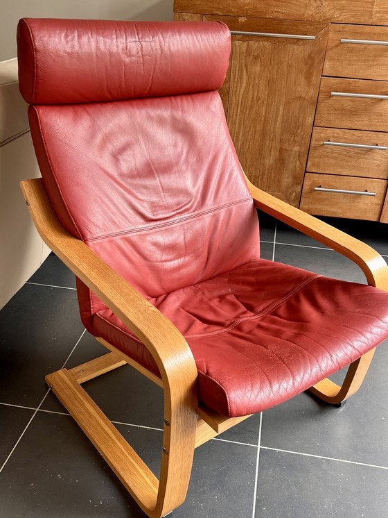 Image 1 of Red leather armchair with footstool