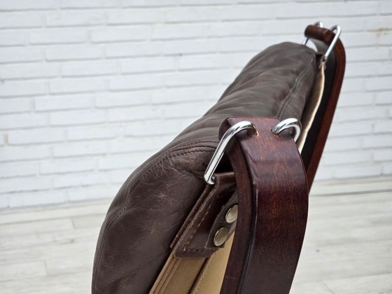 Image 1 of Jaren 70, Noors ontwerp van Sigurd Ressel, loungestoel met voetenbank, model "Falcon".