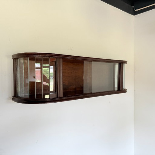 Subtle hanging display case with polished slats