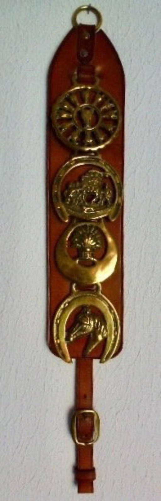 Vintage bell pull with horse-themed copper images.