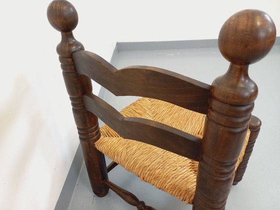 Image 1 of Vintage Charles Dudouyt Brutalist lage stoel in hout en stro uit de jaren 40