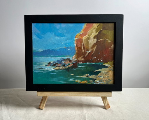 Peinture à l'huile originale représentant un paysage côtier rocheux. Bord de mer rocheux.