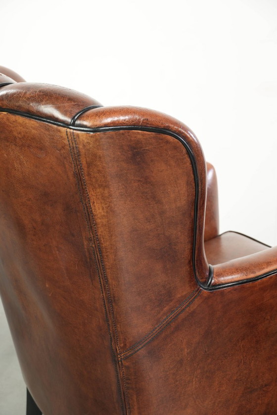 2 fauteuils en peau de mouton au design unique, avec passepoil noir et couleurs profondes. – Leather (photo 16 of 20)