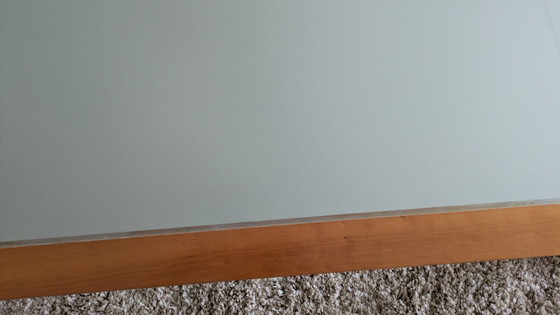 Image 1 of cherry wood red coffee table with sleek glass top from 1996