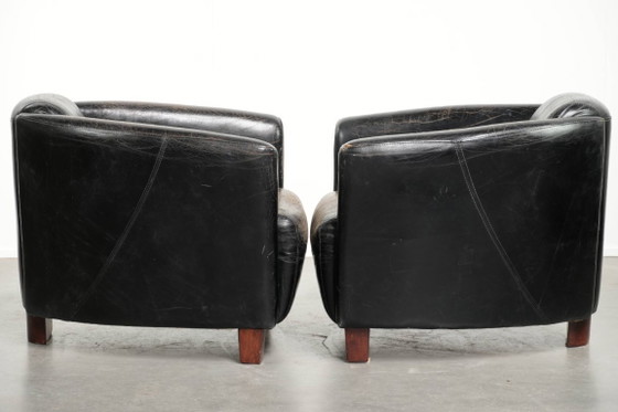 Image 1 of 2x rugged black vintage cowhide Aviator design armchairs with a distinctive look