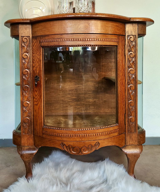 Vitrinekastje vroeg Art Deco met rond glas