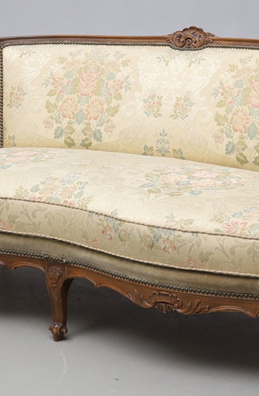 Antique-inspired Rococo style 3-seater sofa with a gilt wooden frame and floral brocade upholstery, in good condition with minor