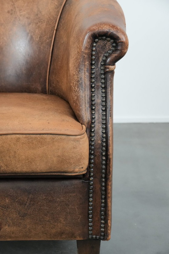 Image 1 of Timeless vintage sheepskin club armchair with character and a beautiful patina