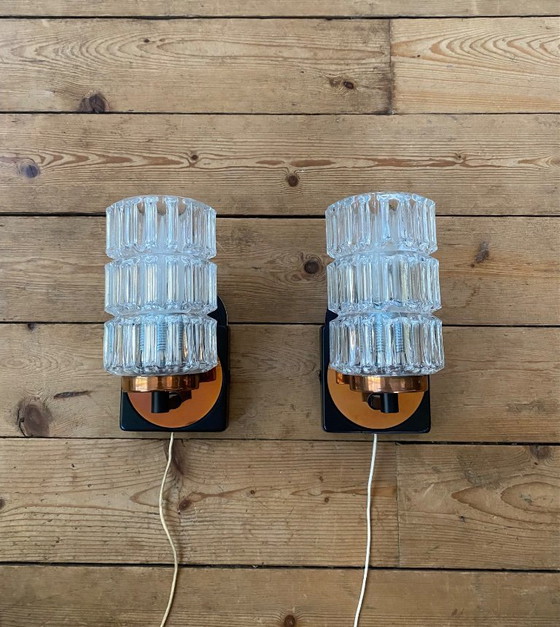 Image 1 of Een paar vintage koperen wandlampen van Phillips uit de jaren 70.