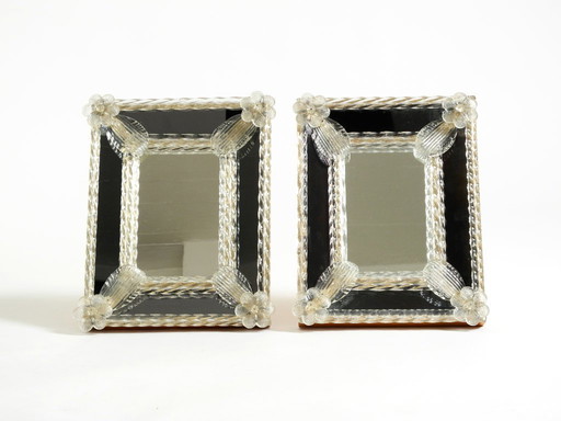 Two beautiful Venetian Mid-Century Modern table mirrors with Murano glass rosettes. Made in Italy.
