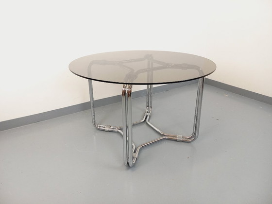 Image 1 of Round vintage dining table in smoked glass and chromed metal in the Space Age style of the 70s