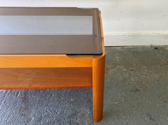Image 1 of Table basse en teck style années 50 avec plateau en verre fumé, par Myer