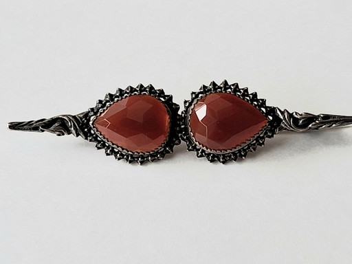 3 antique silver jewelry pieces with faceted Carnelian stones and round-cut Baltic Amber.