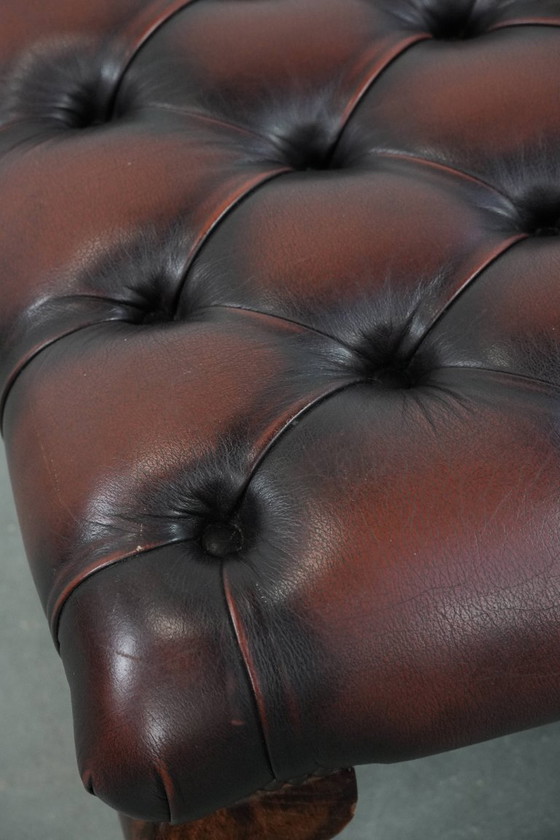 Image 1 of Dark brown Chesterfield footstool made of cowhide