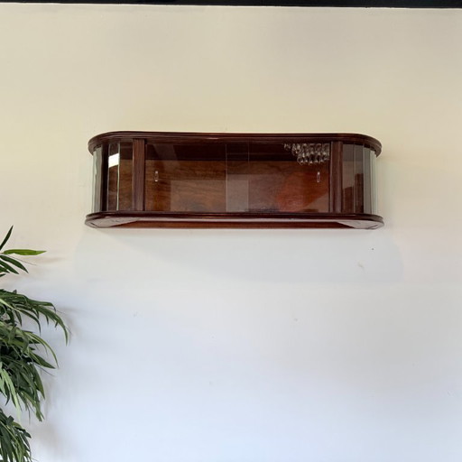 Subtle hanging display case with polished slats