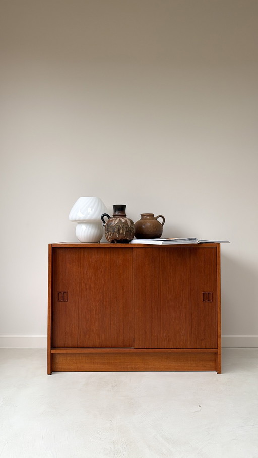 Vintage Danish wooden cabinet with sliding doors