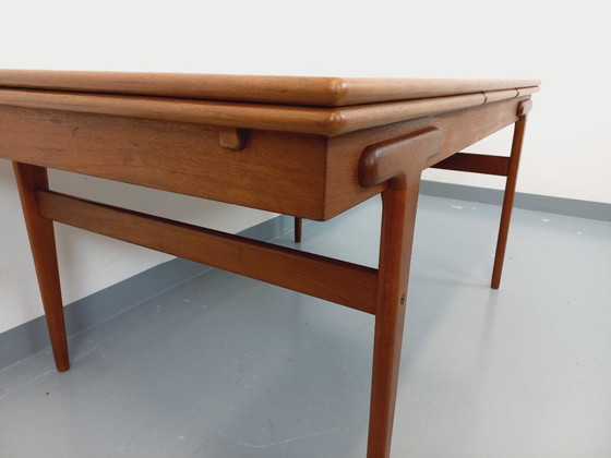 Image 1 of Vintage Scandinavian rectangular dining table by Ejvind A. Johansson from the 50s and 60s in teak with integrated extensions