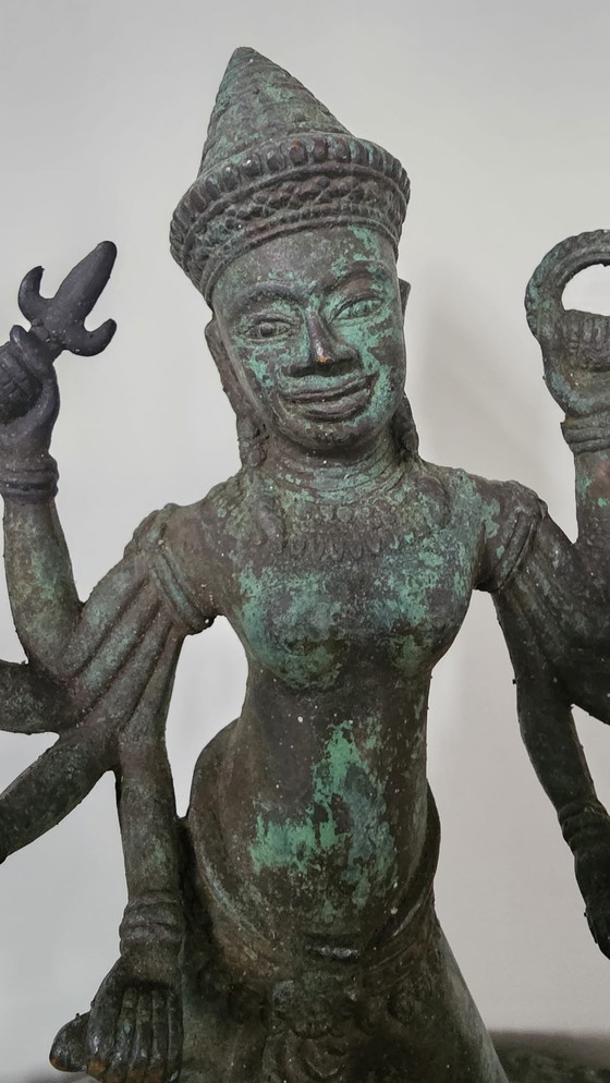 Image 1 of Heavy bronze Asian statue with multiple arms – sculptural statement