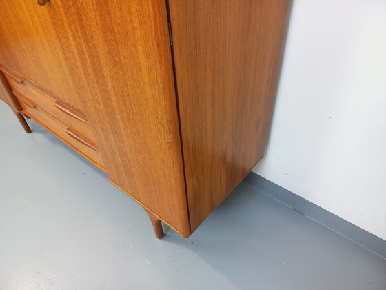 Image 1 of Scandinavische vintage kledingkast in teakhout uit de jaren 60 van ontwerpers Tricoire en Vecchione voor "Meubles TV Paris".