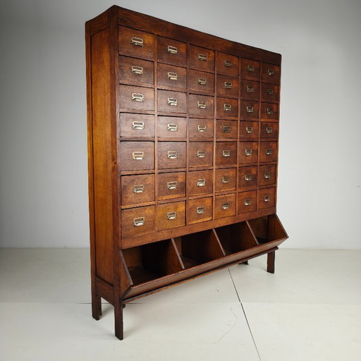 Oak apothecary cabinet from the early 20th century with 42 drawers