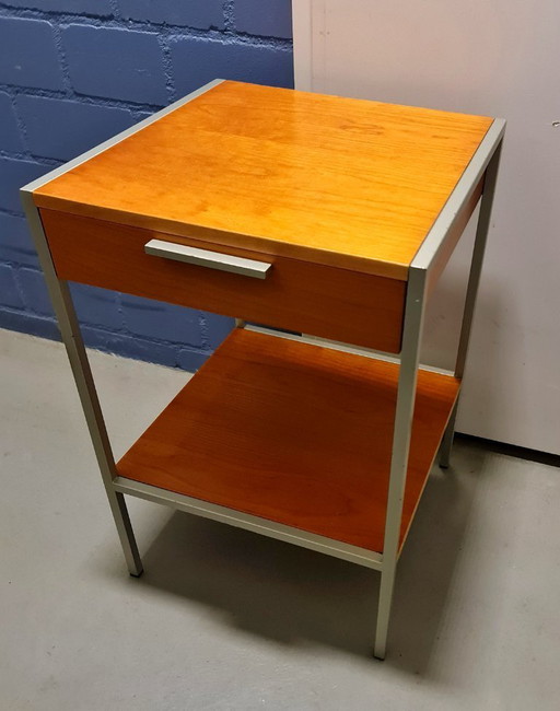 Mid-century vintage bedside table made of wood and metal in the style of George Nelson