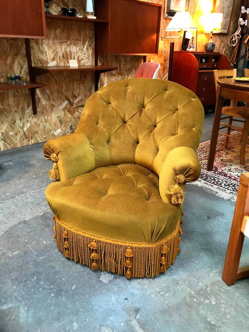 Fauteuil crapaud capitonné