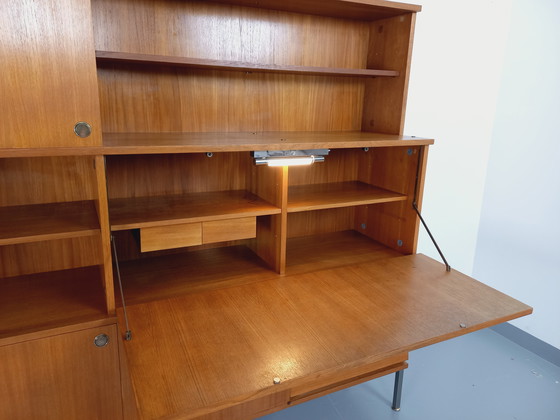 Image 1 of Louis Paolozzi's vintage modernist secretary bookcase for Monopoly in teak and metal from the 60s