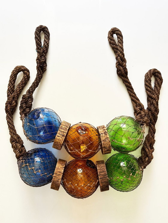 Image 1 of Fishing float made of blown glass, cork, and rope. France, 1960s