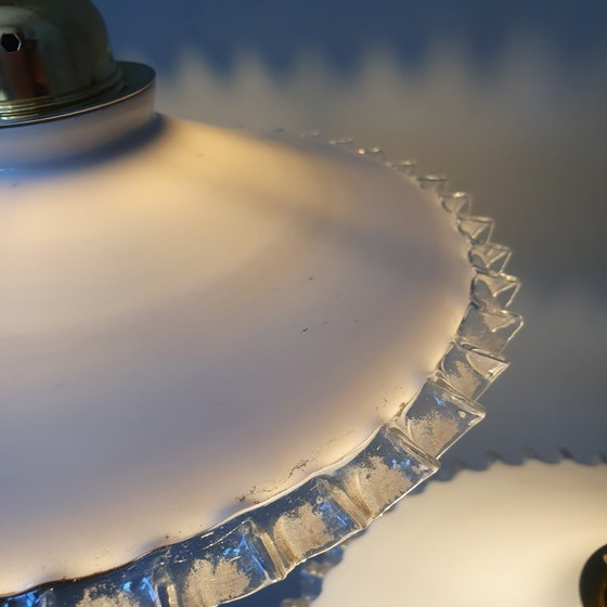 Image 1 of 2 vintage hanglampen van wit opaline glas met een transparante sierrand.