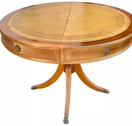 Round mahogany table with English-style leather top