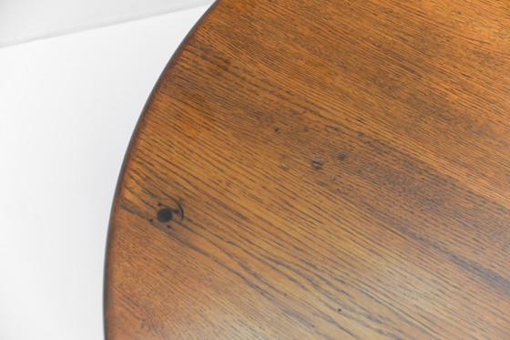 Image 1 of Ronde eikenhouten Franse salontafel in Pierre Chapo-stijl, jaren 60.