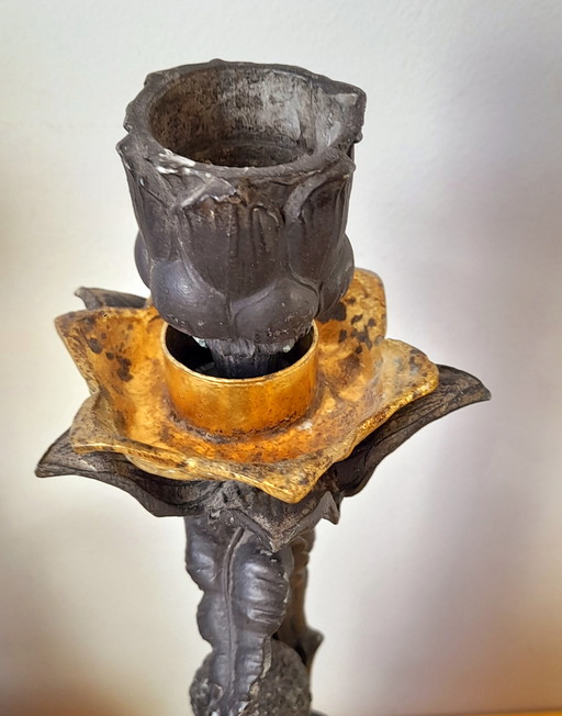 Coppia di candelabri barocchi in peltro raffiguranti putti