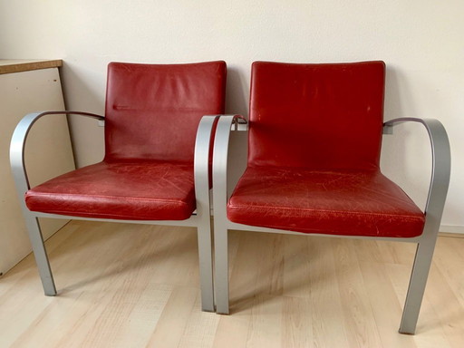 2 red leather Leolux Sentia armchairs