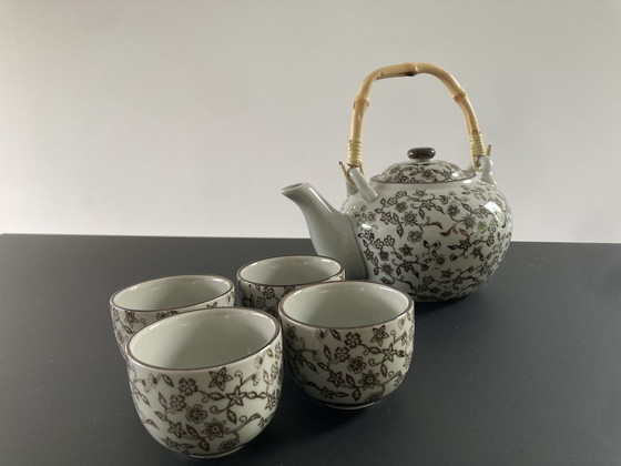 Image 1 of Gray ceramic tea set with brown floral pattern, four cups and a teapot