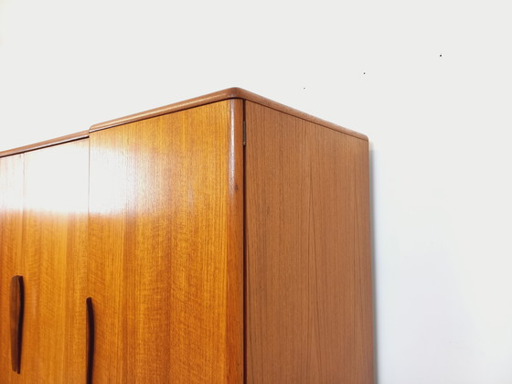 Image 1 of Scandinavische vintage kledingkast in teakhout uit de jaren 60 van ontwerpers Tricoire en Vecchione voor "Meubles TV Paris".