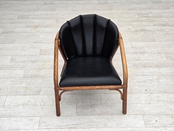 Image 1 of 1970s, Danish armchair, rattan, black artificial leather.