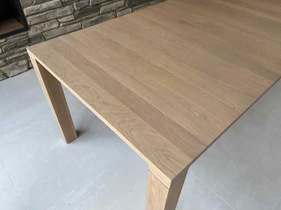 Image 1 of Leolux Vivre oak dining table 240cm